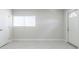 Clean empty room with tile floor, white walls, one window and two doors at 226 Palmyra Dr, Orlando, FL 32807