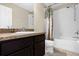 Bathroom with vanity, granite countertop, and a shower with a stylish shower curtain at 2261 Brookridge Trl, Sanford, FL 32773