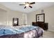 Bedroom featuring a tray ceiling, a ceiling fan, carpeted floors, and dresser at 2261 Brookridge Trl, Sanford, FL 32773