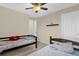 Shared bedroom with a ceiling fan, two twin beds, and neutral paint for a cozy feel at 2261 Brookridge Trl, Sanford, FL 32773