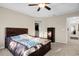 Bedroom featuring a tray ceiling, a ceiling fan, and an open closet at 2261 Brookridge Trl, Sanford, FL 32773