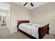 Neutral bedroom featuring a single bed, a ceiling fan and a hallway leading to another room at 2261 Brookridge Trl, Sanford, FL 32773