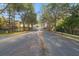 Gated entrance to community lined with trees at 2261 Brookridge Trl, Sanford, FL 32773