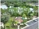 Aerial view of a community pool and lake near townhouses at 2261 Brookridge Trl, Sanford, FL 32773