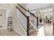 Bright and spacious staircase leading to the upper level with views of the open-concept living area at 2261 Brookridge Trl, Sanford, FL 32773