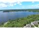 Panoramic aerial shot of a vast lake surrounded by lush forests and serene waterfront properties at 235 S Shadowbay Blvd, Longwood, FL 32779