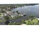 Breathtaking aerial view of luxurious waterfront properties with private docks along a serene lake at 235 S Shadowbay Blvd, Longwood, FL 32779