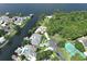 Stunning aerial view of luxurious waterfront homes with private pools and docks on a picturesque lake at 235 S Shadowbay Blvd, Longwood, FL 32779