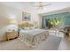Relaxing bedroom with a king-size bed, neutral colored walls, and view of the garden at 235 S Shadowbay Blvd, Longwood, FL 32779