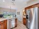 Bright kitchen featuring stainless steel refrigerator and view of a garden at 235 S Shadowbay Blvd, Longwood, FL 32779