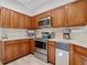 Traditional kitchen with stainless steel appliances and light countertops at 235 S Shadowbay Blvd, Longwood, FL 32779