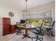 Bright office area featuring a bay window with garden views and decorative chandelier at 235 S Shadowbay Blvd, Longwood, FL 32779