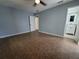 Bedroom with tile floor leading to a bathroom, offering a private and convenient layout at 2417 Yale Ave, Sanford, FL 32771