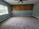 Spacious bedroom featuring a ceiling fan and a large window offering natural light at 2417 Yale Ave, Sanford, FL 32771