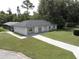 Aerial view of the home's exterior and surrounding yard with a screened in porch at 2417 Yale Ave, Sanford, FL 32771