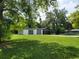 Detached garage featuring multiple bays and an attached carport with a spacious yard at 2417 Yale Ave, Sanford, FL 32771
