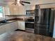 Modern kitchen featuring stainless steel appliances, ample cabinet space, and durable counter tops at 2417 Yale Ave, Sanford, FL 32771