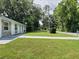 View of the home's manicured lawn and the surrounding neighborhood street at 2417 Yale Ave, Sanford, FL 32771
