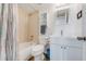 Cozy bathroom with a shower-tub combo, toilet, vanity and mirror with ample lighting at 2700 Ocean Shore Blvd # 515, Ormond Beach, FL 32176