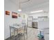 Modern kitchen and dining area featuring stainless steel appliances and bar seating at 2700 Ocean Shore Blvd # 515, Ormond Beach, FL 32176
