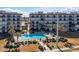 Beautiful pool and common area surrounded by lush landscaping at beachfront condo buildings at 2700 Ocean Shore Blvd # 515, Ormond Beach, FL 32176
