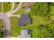 Overhead view of home showcasing roof, yard, and close proximity to neighboring homes and mature trees at 3016 Rogan Rd, Orlando, FL 32812