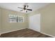 Bright bedroom with ceiling fan, a window, and a closet offers a comfortable living space at 3016 Rogan Rd, Orlando, FL 32812