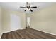 Spacious bedroom with hardwood floors, a ceiling fan, closet, and bright natural light at 3016 Rogan Rd, Orlando, FL 32812