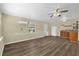 Open living space with wood flooring and abundant light at 3016 Rogan Rd, Orlando, FL 32812