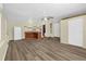 Living room has wood flooring and kitchen area at 3016 Rogan Rd, Orlando, FL 32812