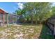 A spacious backyard features an enclosed pool area and ample outdoor space at 3237 Newmark Dr, Deltona, FL 32738