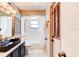 Bathroom with black sink, gold hardware, and a shower/tub combo at 3237 Newmark Dr, Deltona, FL 32738