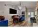 Cozy dining area with stylish lighting, a modern table, and easy access to the kitchen at 3237 Newmark Dr, Deltona, FL 32738