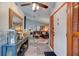 Open-concept living room with wood-look floors, vaulted ceilings, and modern decor at 3237 Newmark Dr, Deltona, FL 32738