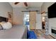 Main bedroom featuring luxury vinyl floors and a sliding barn door entrance to the main bathroom at 3237 Newmark Dr, Deltona, FL 32738