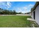 Large grassy backyard featuring a white perimeter fence at 3354 Summerdale Way, Kissimmee, FL 34746