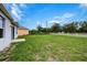 Expansive backyard features lush green grass and a white fence, perfect for outdoor activities at 3354 Summerdale Way, Kissimmee, FL 34746