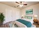 Nicely staged bedroom with wood-look floors, ceiling fan, and ample natural light at 3354 Summerdale Way, Kissimmee, FL 34746