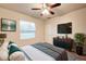 Cozy bedroom featuring a large window, and stylish decor at 3354 Summerdale Way, Kissimmee, FL 34746