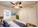 Inviting bedroom with a ceiling fan, large window, and a mounted television at 3354 Summerdale Way, Kissimmee, FL 34746