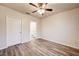 Bright bedroom features wood-look floors and two doors at 3354 Summerdale Way, Kissimmee, FL 34746