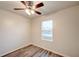 This bedroom features modern vinyl flooring and a bright window for natural light at 3354 Summerdale Way, Kissimmee, FL 34746