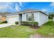 Charming single-story home featuring a well-maintained lawn and a convenient one-car garage at 3354 Summerdale Way, Kissimmee, FL 34746