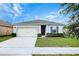 Charming single-story home with a well-manicured lawn, inviting curb appeal, and a one-car garage at 3354 Summerdale Way, Kissimmee, FL 34746