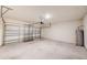 Spacious two-car garage with concrete flooring and plenty of room for storage at 3354 Summerdale Way, Kissimmee, FL 34746