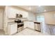 Modern kitchen with stainless steel appliances, granite countertops, and ample cabinet space at 3354 Summerdale Way, Kissimmee, FL 34746