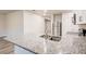 Kitchen island with granite countertop and stainless steel sink at 3354 Summerdale Way, Kissimmee, FL 34746