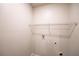 Bright laundry room featuring connections for washer and dryer and a wire shelf at 3354 Summerdale Way, Kissimmee, FL 34746
