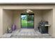 Covered back patio with a ceiling fan, with a gas grill overlooking the backyard at 340 Pheasant Dr, Haines City, FL 33844
