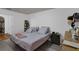 Well-lit bedroom with hard surface flooring and ample storage space in closet and dresser at 340 Pheasant Dr, Haines City, FL 33844